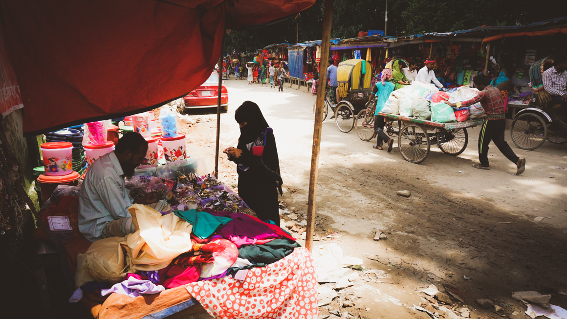 A street lined with sellers in Ershadnagar, one of the study communities. Image by Tasfiq Mahmood