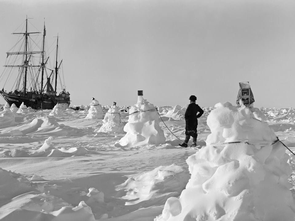 Ice mounds and rope serve as guidance to crew in darkness and blizzards