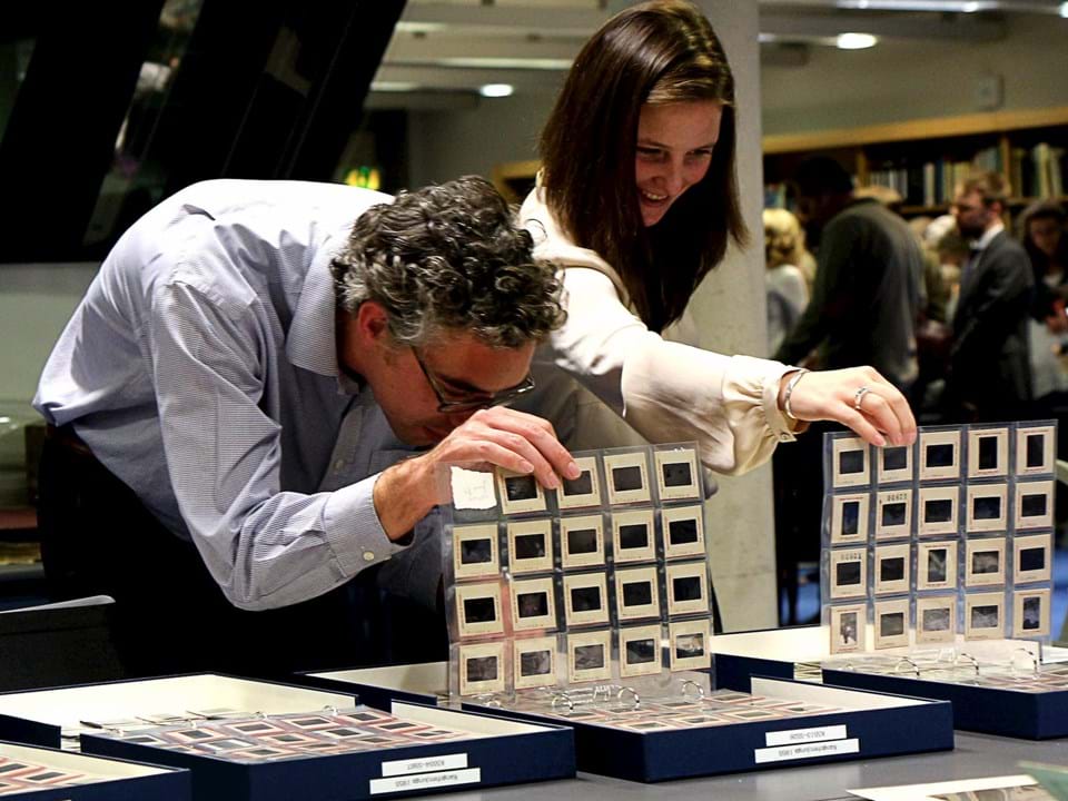 Photo of people looking at the Society's Collections