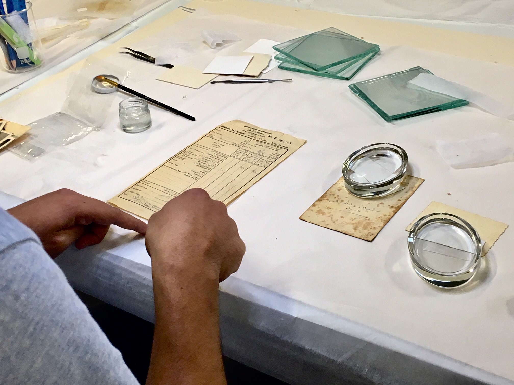 Palestinian Museum, Birzeit, West Bank. September 2019. Archivists show the public how to repair and restore old documents. 