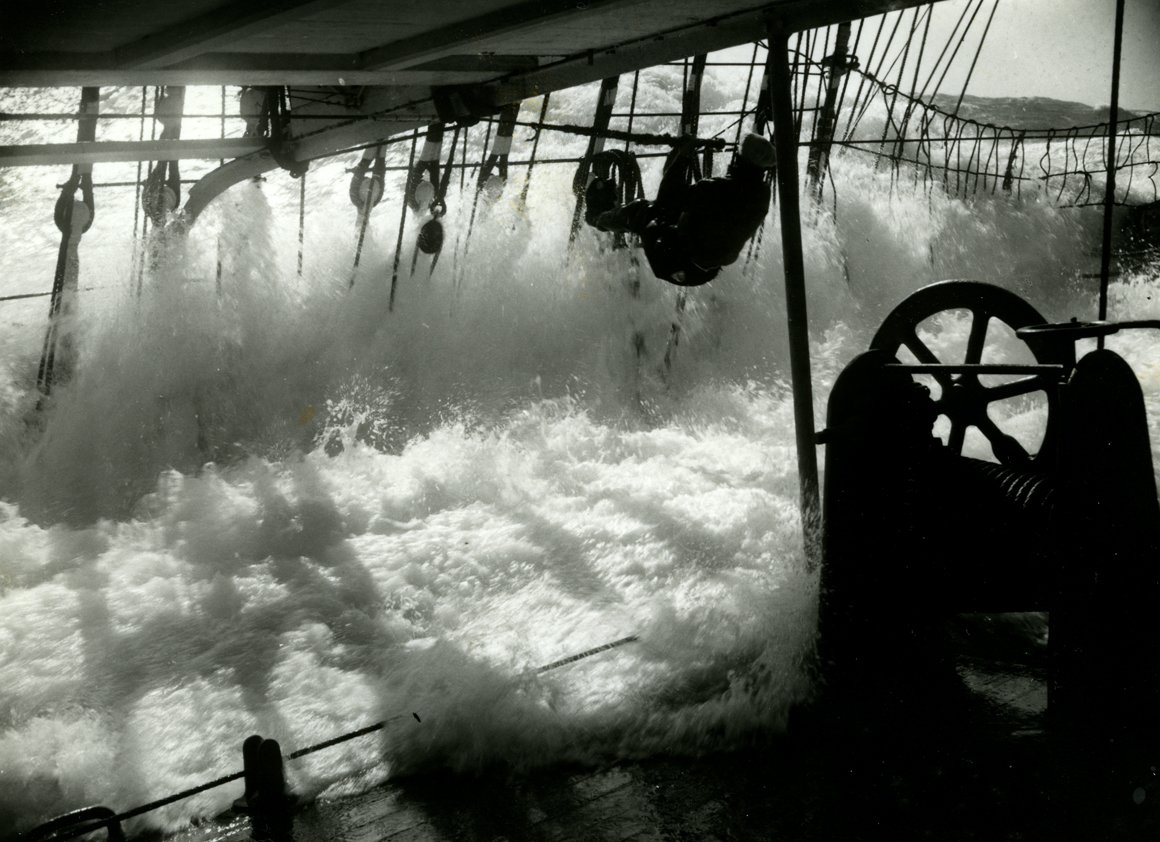  ‘A few seconds later. Jumping for the life-line as a big sea comes aboard'. Photograph by Eric Newby, 1938