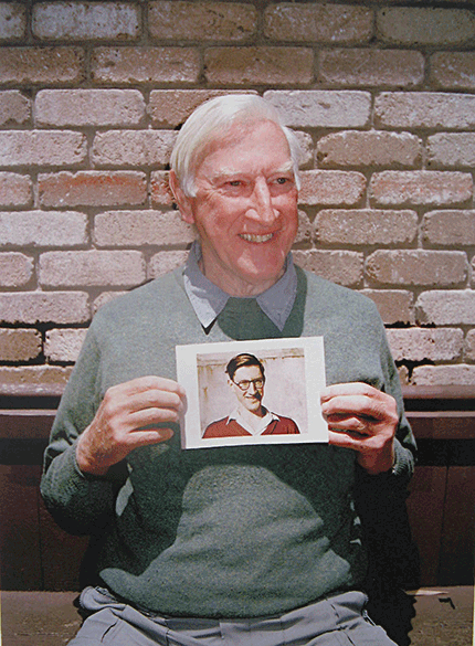 George Band holding a photograph of himself as a young man. Photograph taken by Alf Gregory in Emerald, Australia, 2008. Courtesy of Susan Band
